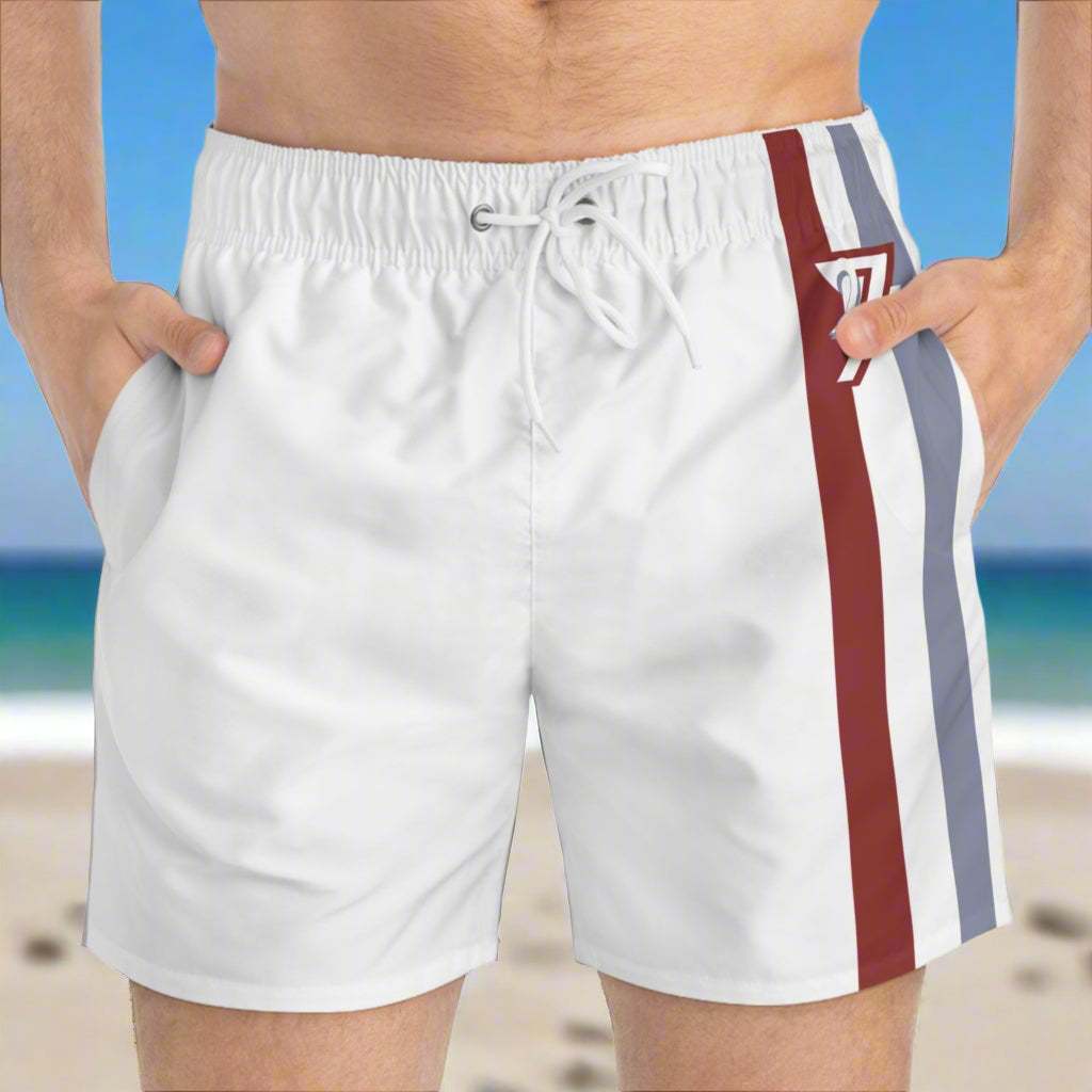 Man wearing the White Beach Shorts with 24/7 red-blue-white triple stripe logo.