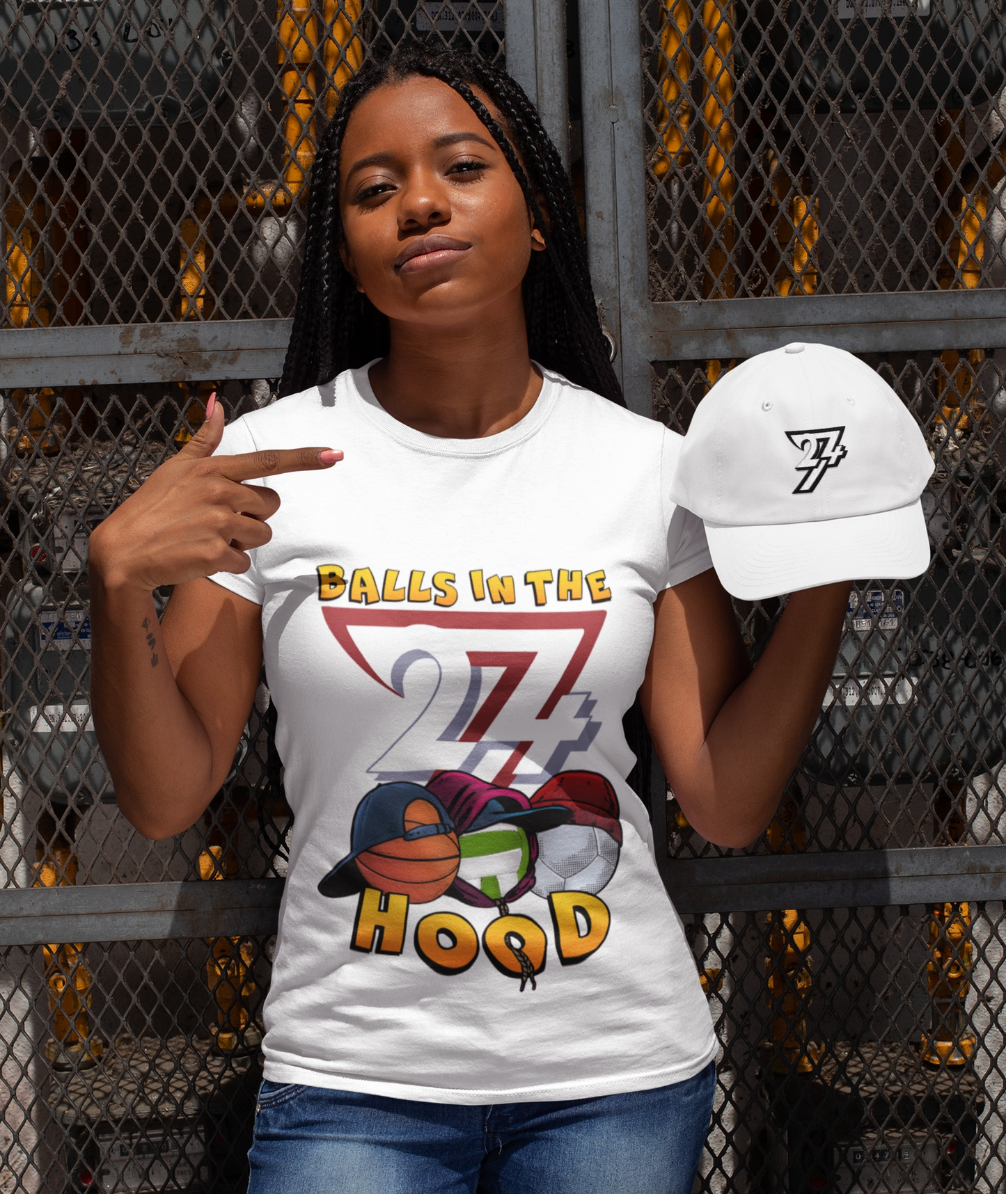 Woman wearing the trademark white 24/7 Logo Baseball Cap and the Balls In The Hood graphic tee