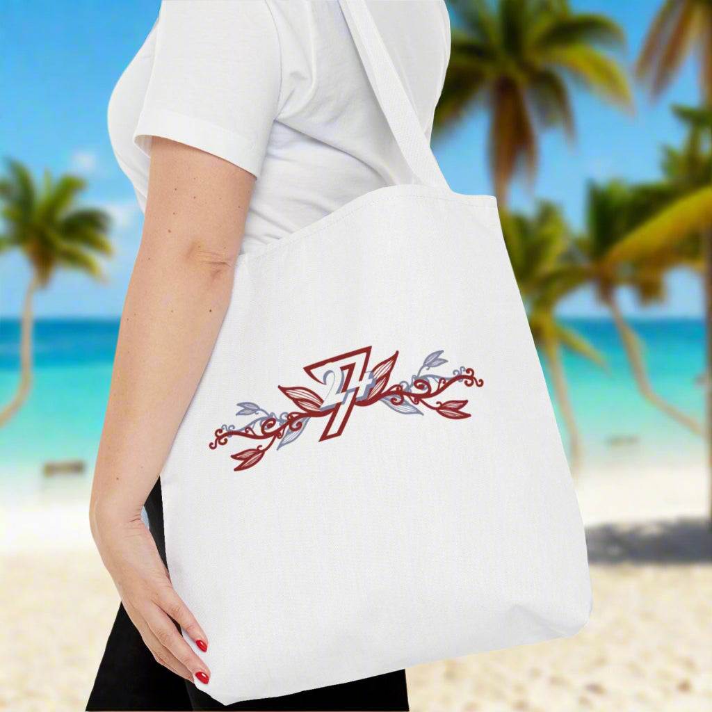 Flower design unique tote bag with white handle on woman's shoulder on a tropical beach
