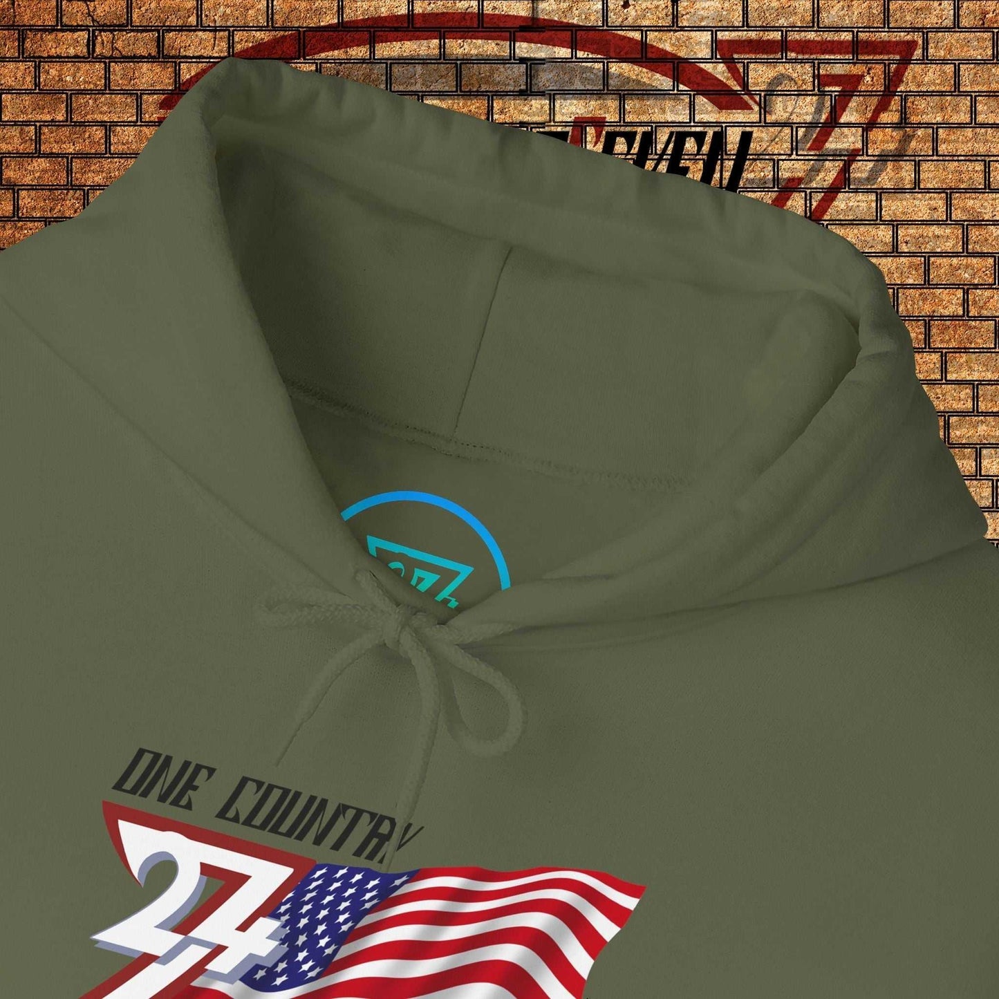 Macro close-up of the inner neck area showing the tear-away label and authentic 24/7 Unique Designs trademark logo.