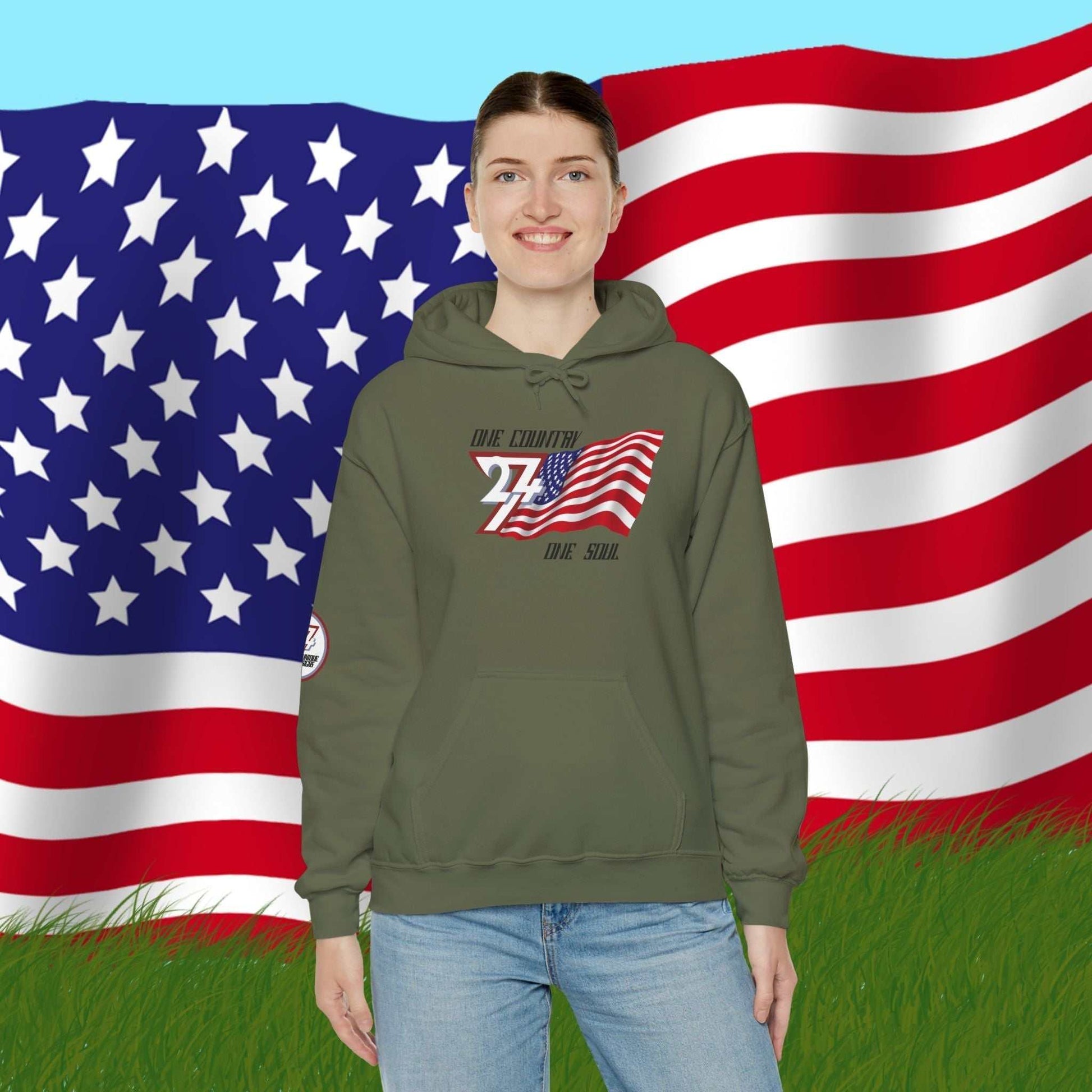 Model wearing the USA "Legacy" edition hoodie in Army Green, showing a bold, refined American streetwear look.