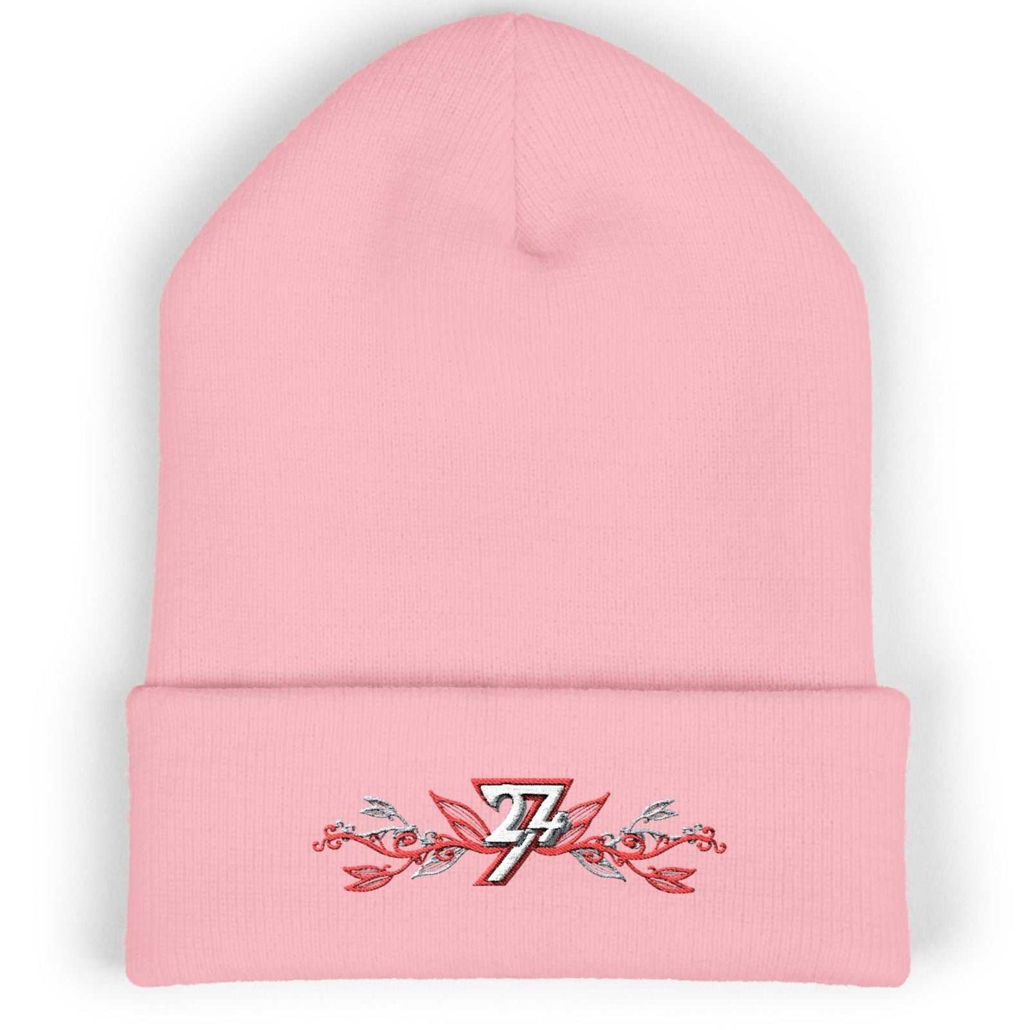 Baby pink cozy winter hat showcasing the elegant floral embroidered logo and 12-inch cuff.