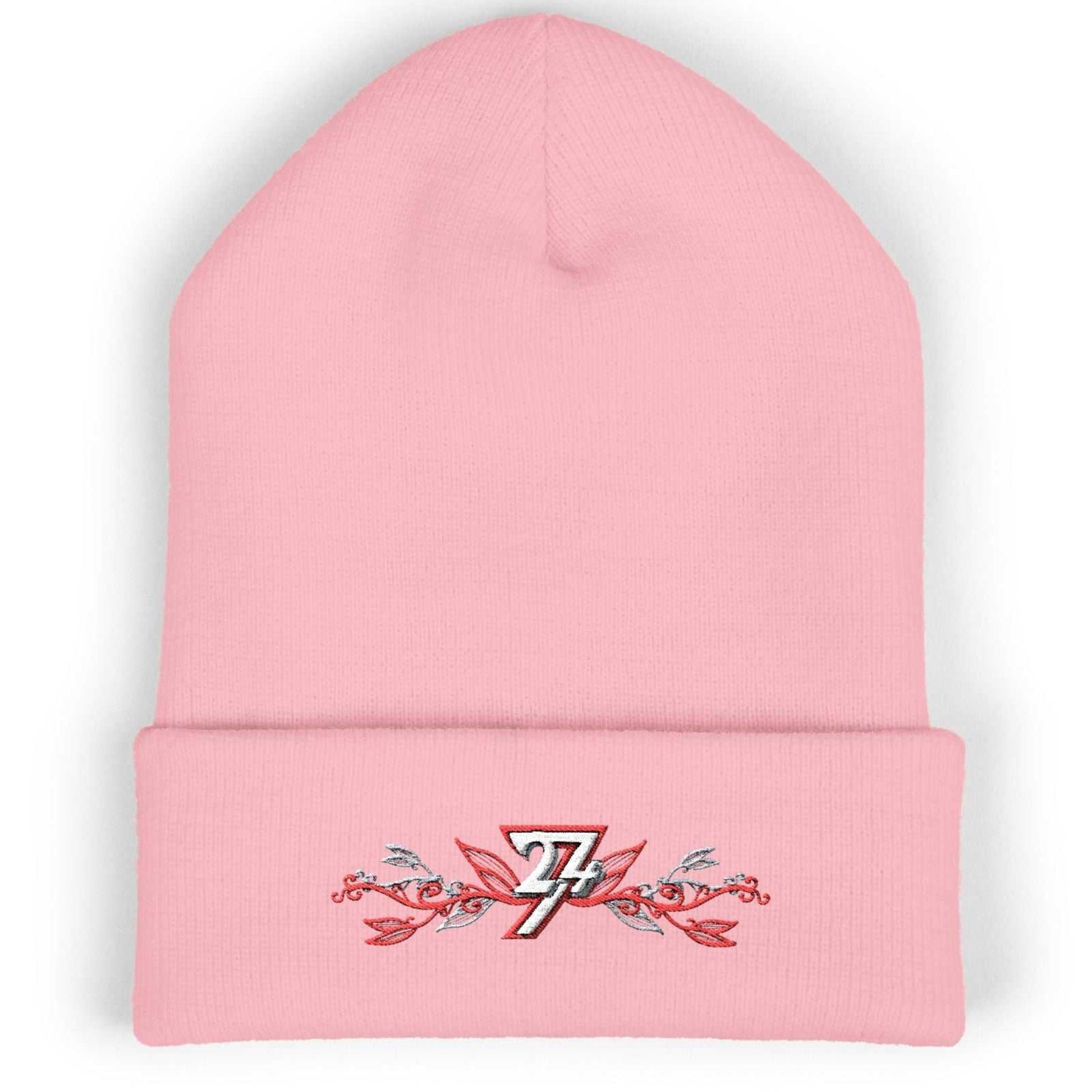 Baby pink cozy winter hat showcasing the elegant floral embroidered logo and 12-inch cuff.