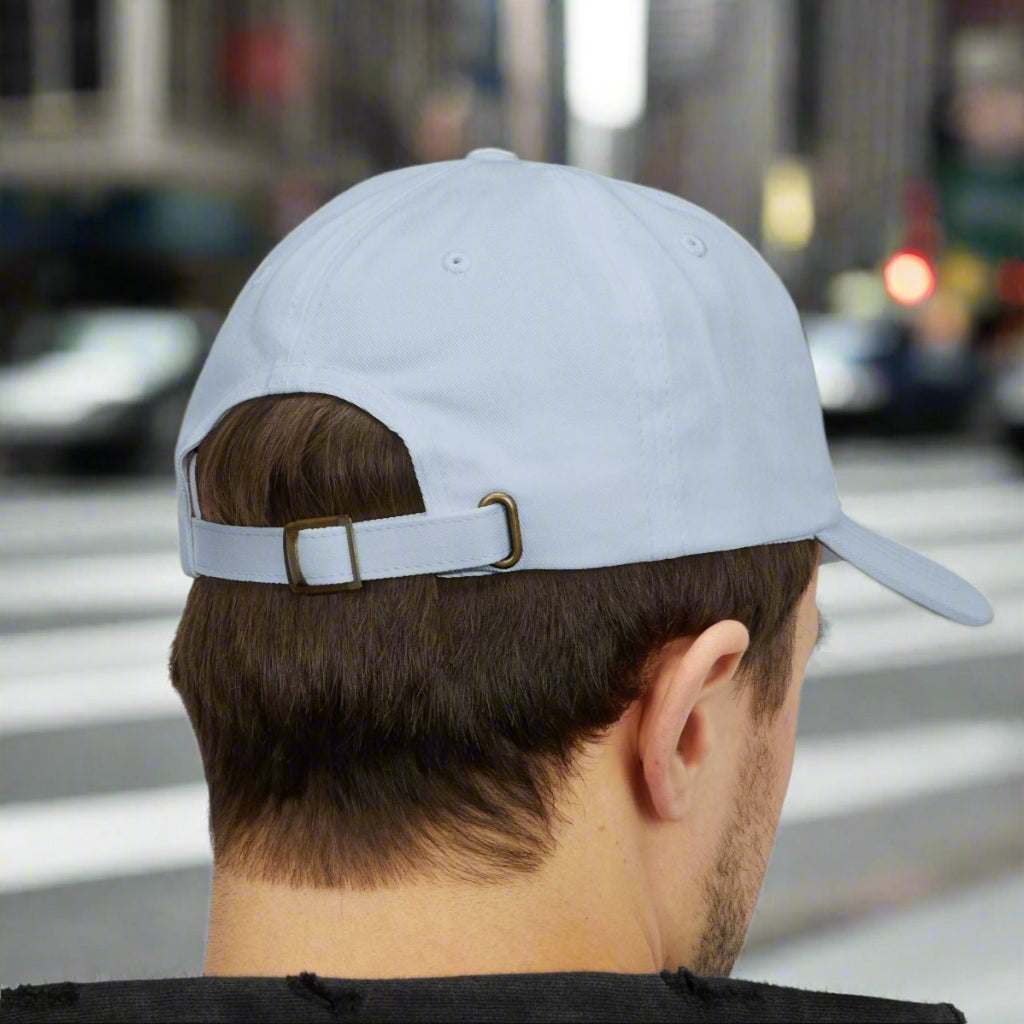 Back view of a man wearing the light blue trendy floral accessory cap.