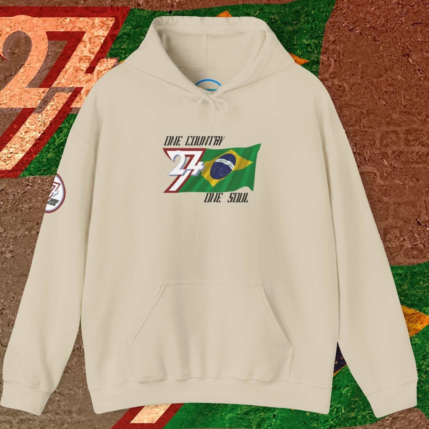 A polished Beige Brazil flag hoodie with our signature hand-drawn art and "One Country One Soul" text.