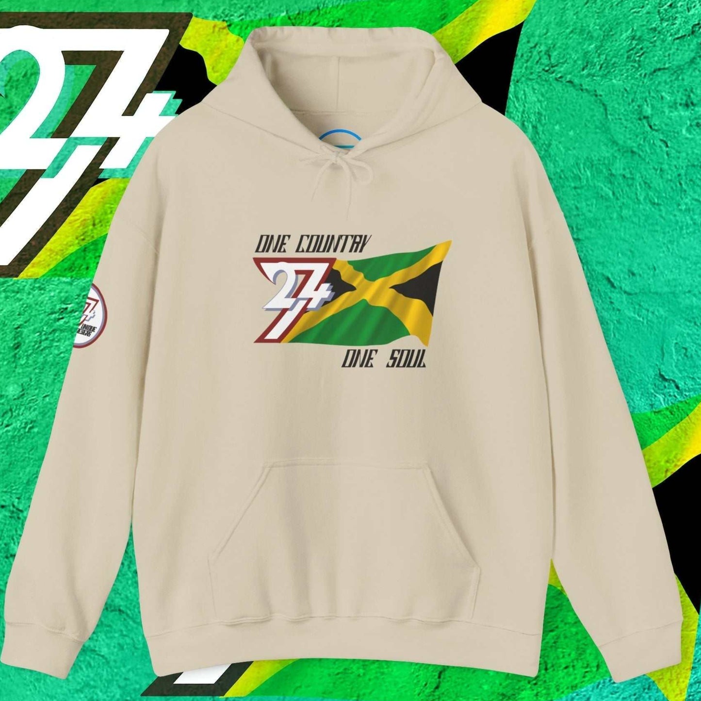 A polished Beige Jamaica flag hoodie with our signature hand-drawn art and "One Country One Soul" text.