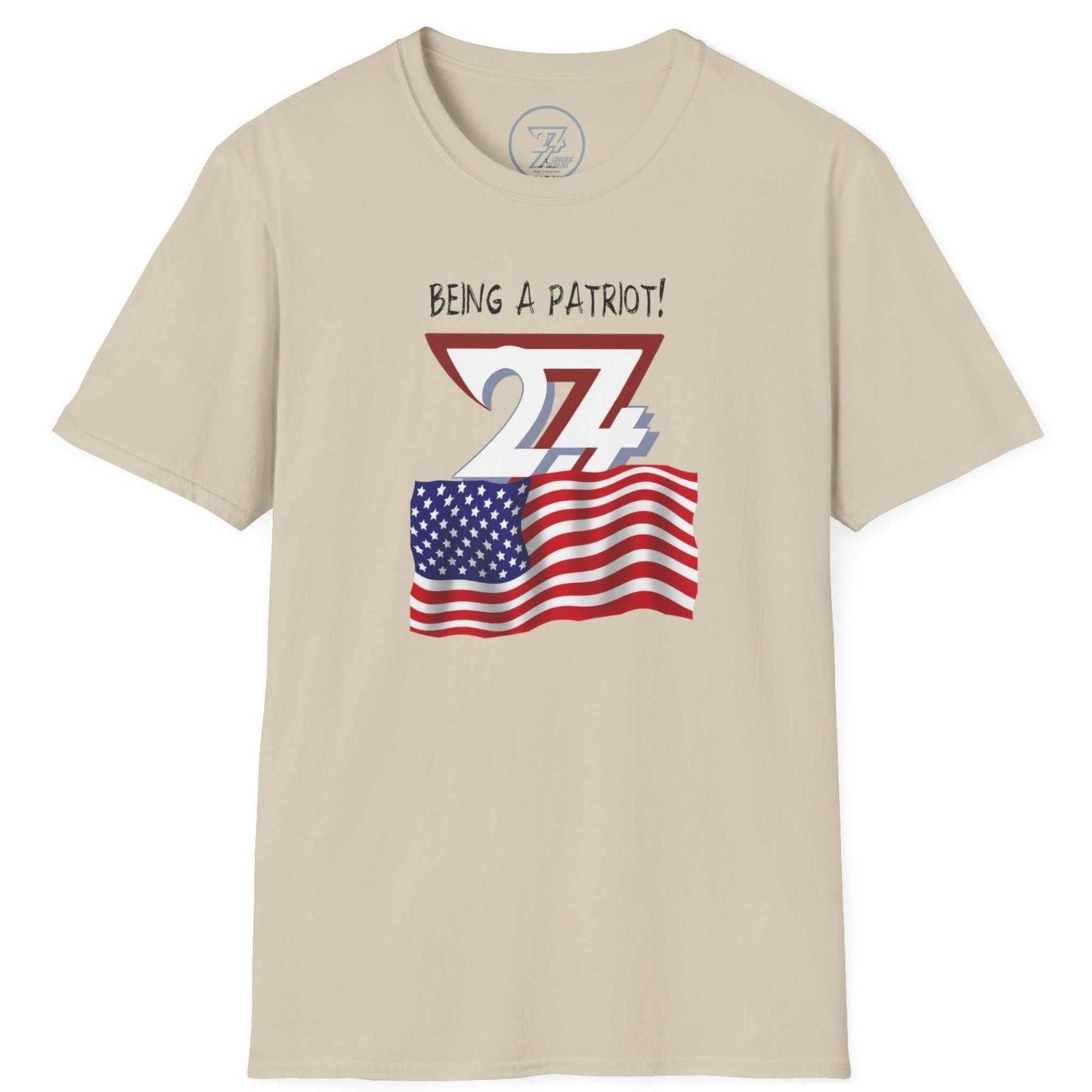 Beige patriotic rally gear tee highlighting the 'Being a Patriot' message, laid flat.