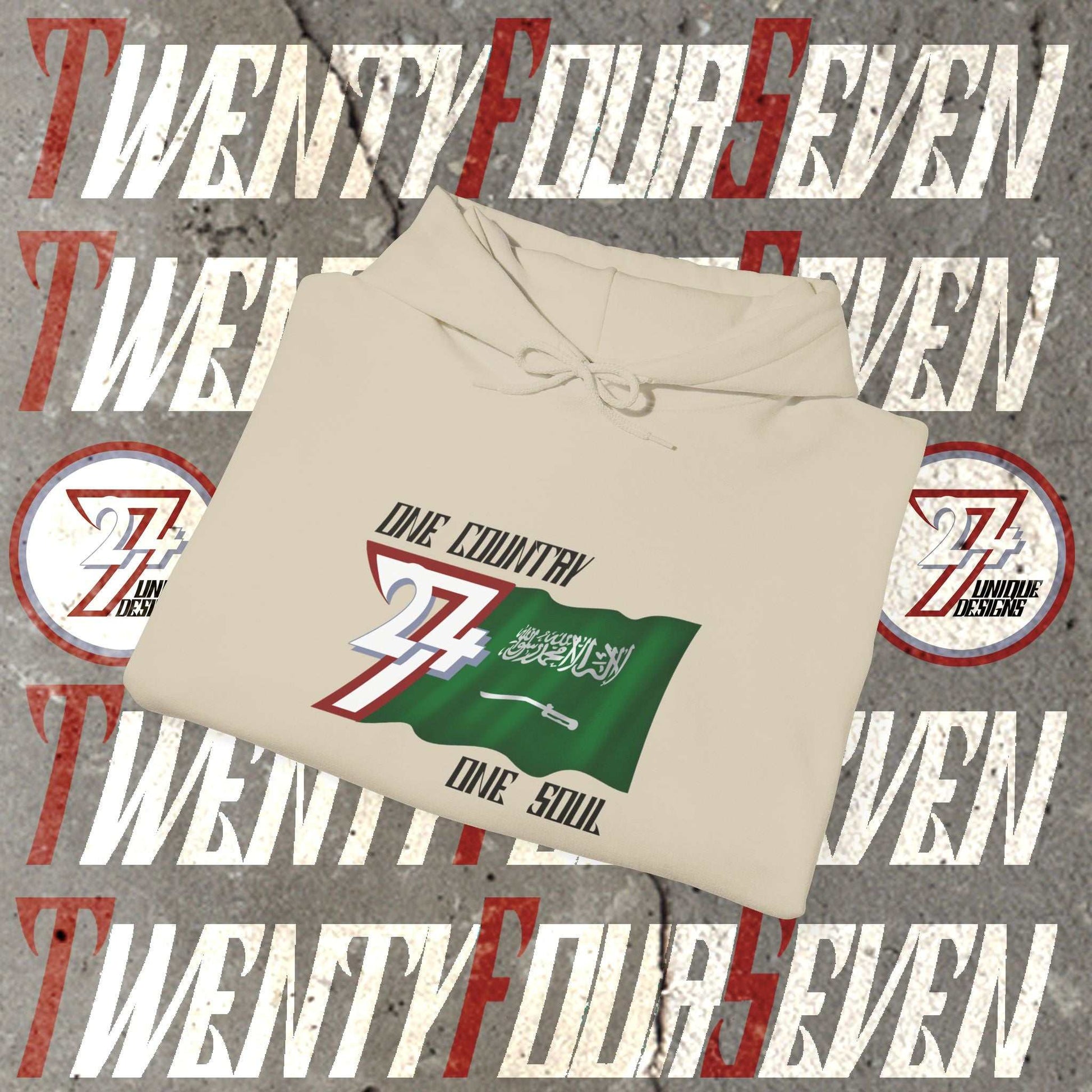 A professional display of the Saudi Arabia flag hoodie in Beige, folded to showcase the refined hand-drawn graphic and 8oz fabric weight.