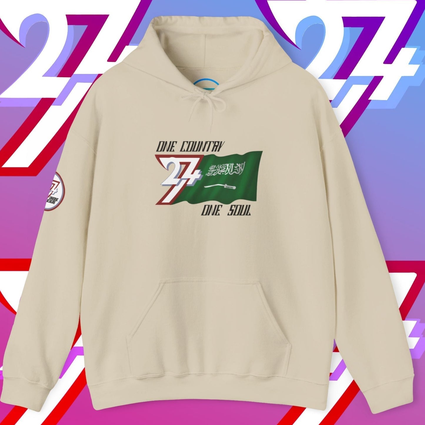 A polished Beige Al-Mamlakah flag hoodie with our signature hand-drawn art and "One Country One Soul" text.