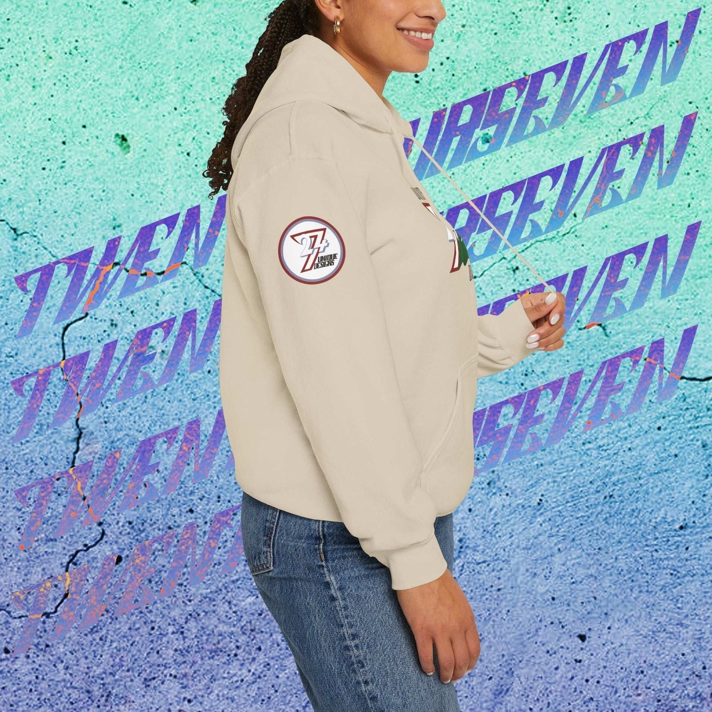 Female model wearing the Al-Mamlakah "Majesty" edition hoodie in Beige, showing a modern, refined Middle Eastern streetwear look.