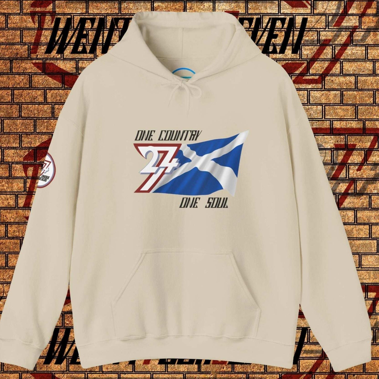 A polished Beige Alba flag hoodie with our signature hand-drawn art and "One Country One Soul" text.