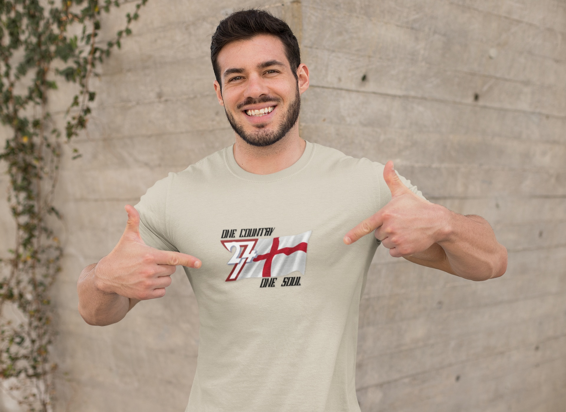 Male model wearing the England "Valor" edition tee in Light Heather Gray, showing a clean, refined streetwear look.