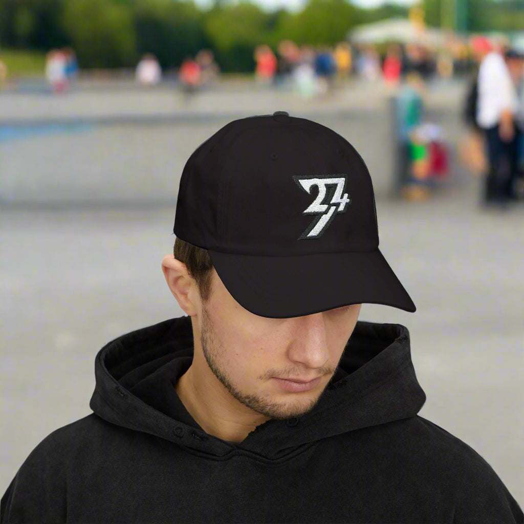  Black embroidered baseball hat with the classic 24/7 logo on male model