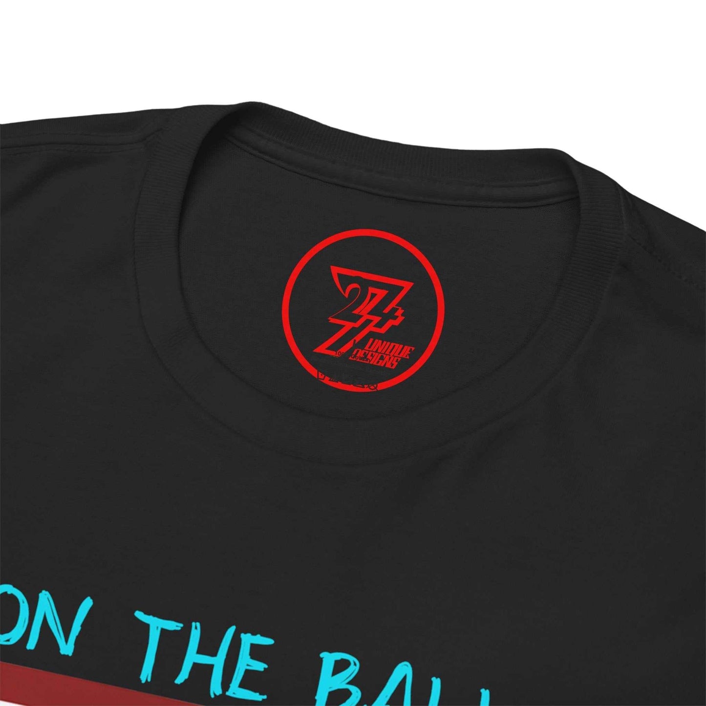 Close-up of the ribbed, seamless collar on the black athletic shirt, clearly showing the official 24/7 Unique Designs trademark logo inner label branding.