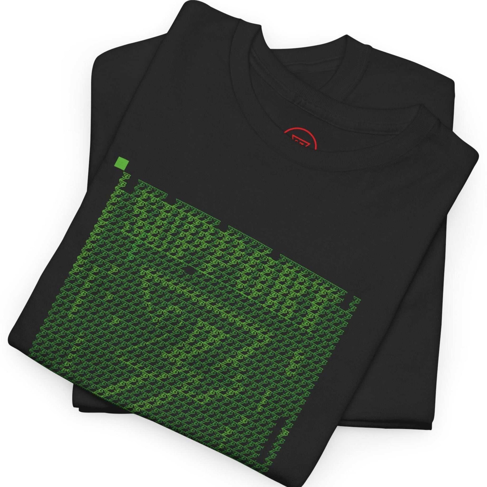 Neatly folded black hacker aesthetic t-shirt highlighting the shimmering green micro-logo graphic and the folded sleeve with the artist mark visible.
