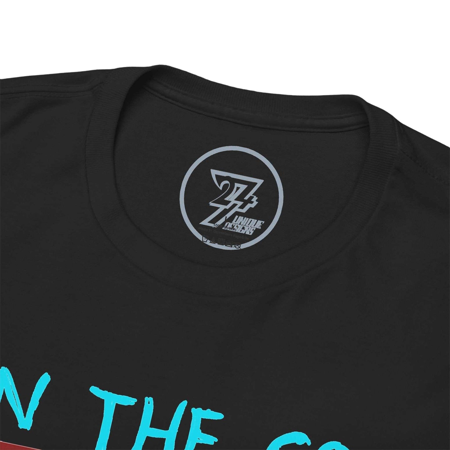 Close-up of the clean crew neckline on the black runner t-shirt, clearly showing the official 24/7 Unique Designs trademark logo inner label branding.