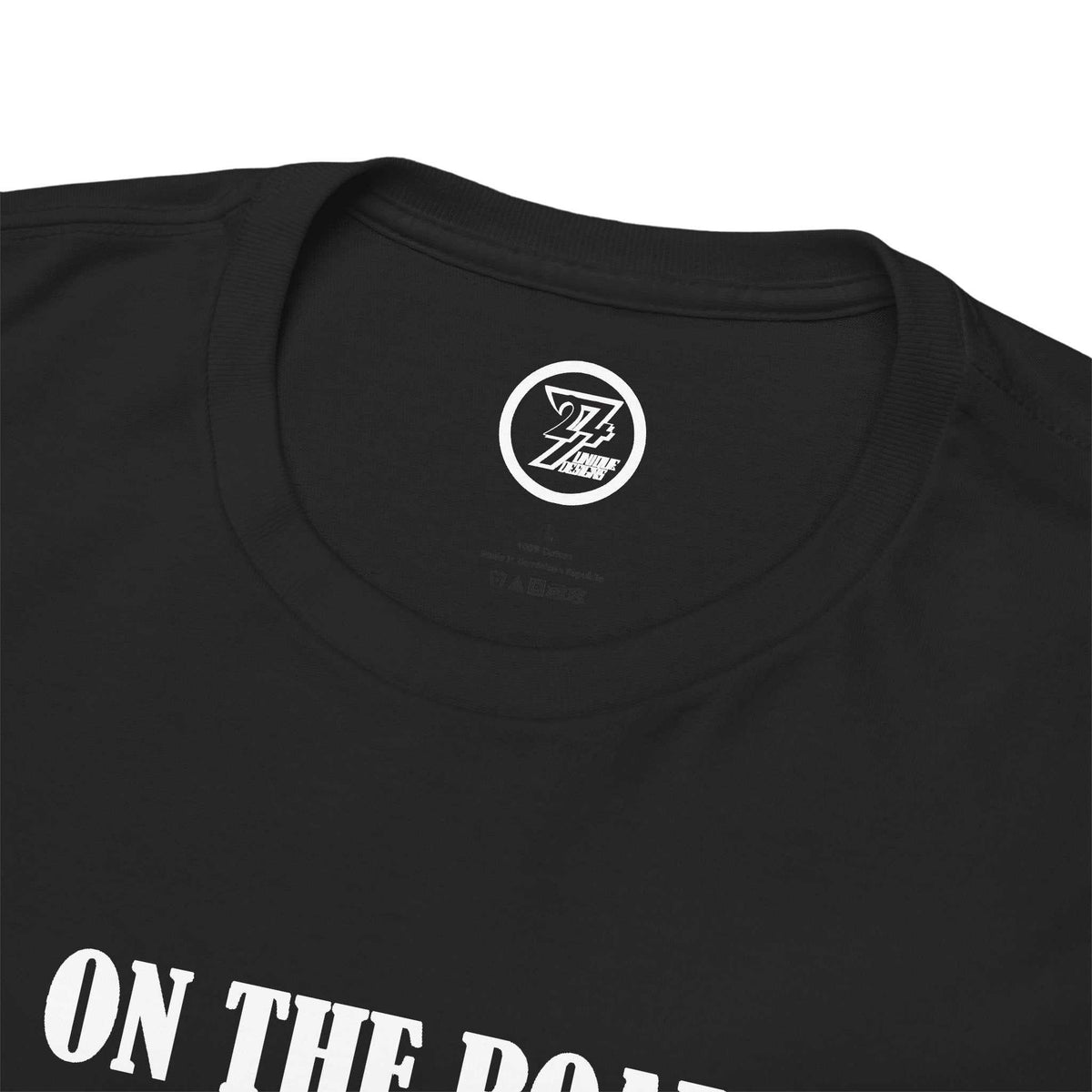 Close-up of the ribbed knit collar on the black vintage Aston Martin DB4 shirt, clearly showing the official 24/7 Unique Designs trademark logo inner label.