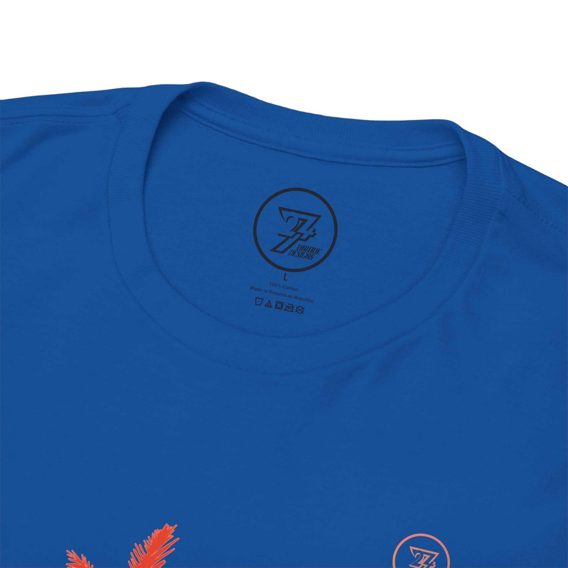 Close-up of the blue tropical summer t-shirt with the 24/7 logo on the collar against a white background
