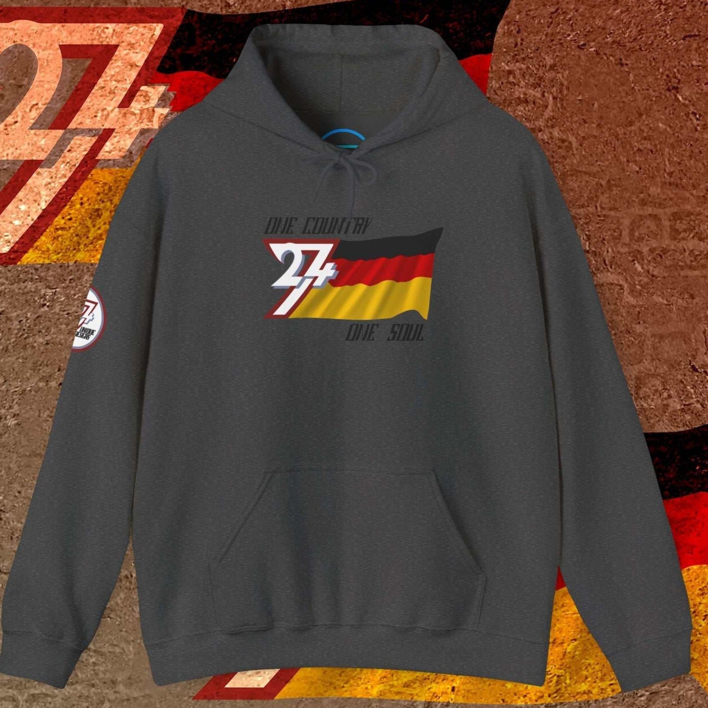 A deep Charcoal Deutschland hoodie showcasing the sharp, hand-sketched German flag and "One Country One Soul" text.
