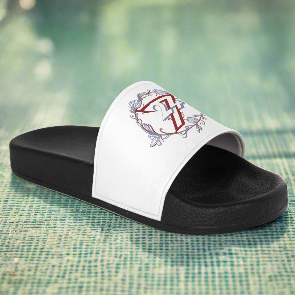 Side view of comfortable pool shoes showing the contoured black footbed and graphic white strap.