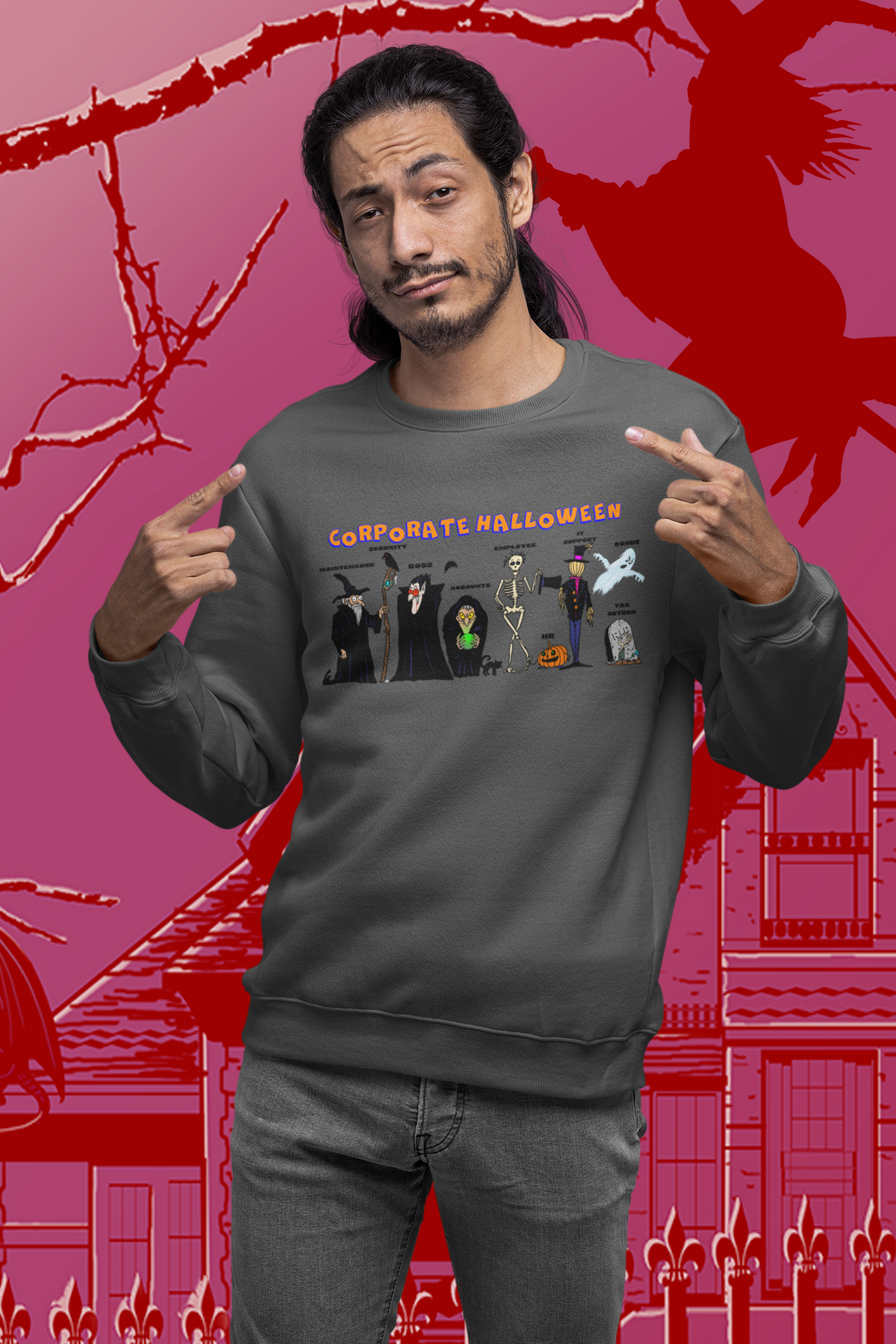 A man wearing a dark gray crewneck sweatshirt with a 'Corporate Halloween' graphic print, posing with his hands pointing to the chest graphic against a red and pink Halloween-themed background.