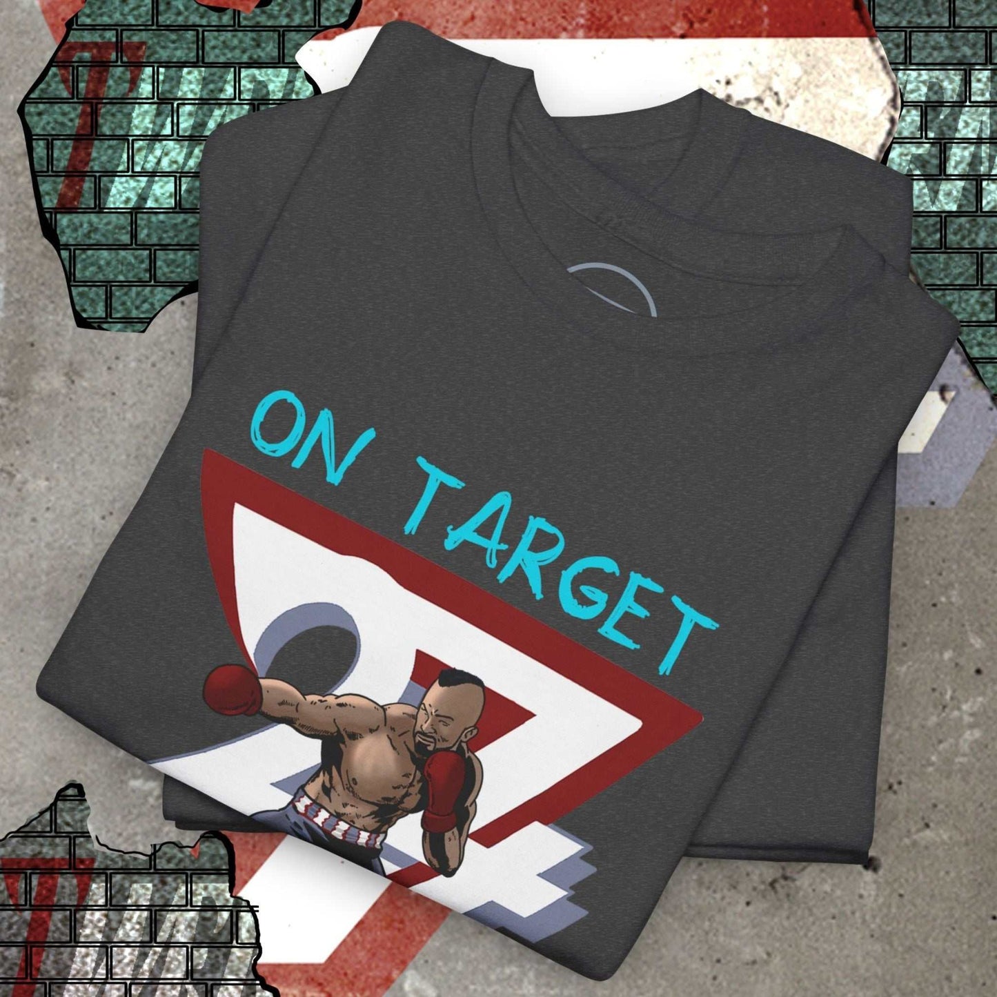 Neatly folded dark heather grey boxing graphic tee highlighting the crisp 90s comic front print and premium fabric, laid flat.