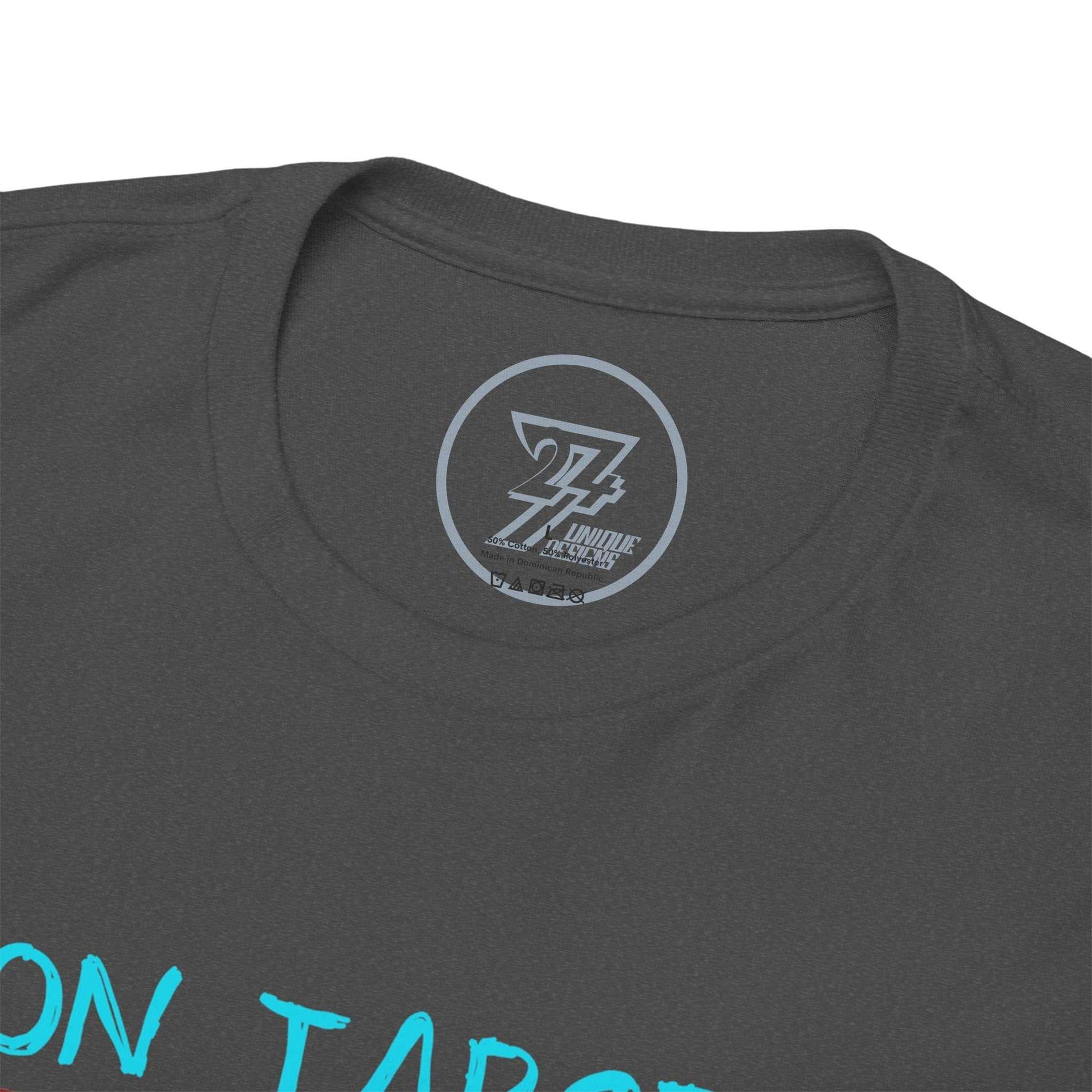 Close-up of the seamless crew neckline on the dark heather fighter shirt, clearly showing the official 24/7 Unique Designs trademark logo inner label branding.
