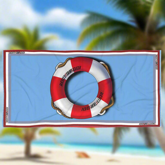 Designer coastal towel featuring a classic life ring and 24/7 logo design.