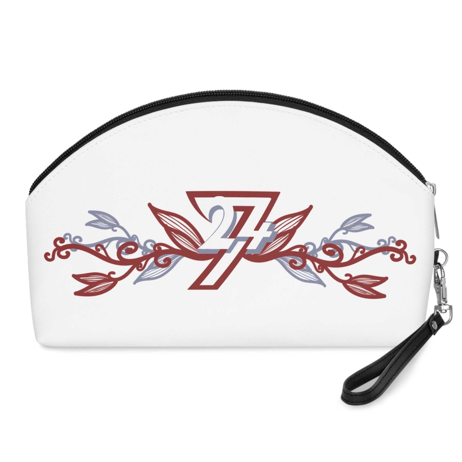 Back view of the faux leather makeup bag, showing the continuous elegant floral artwork and the black top zipper, laid flat.