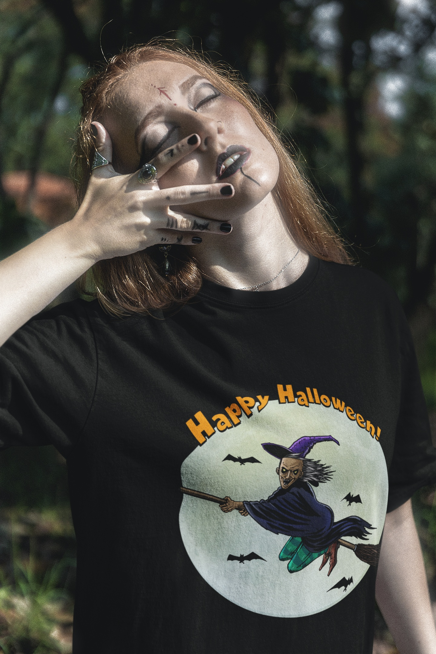 Female model demonstrating the classic unisex fit of the black 24/7 Unique Designs seasonal top.