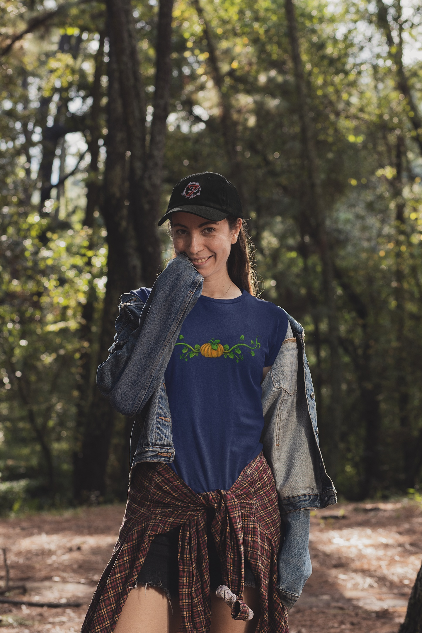 Front view of a female model styling the navy pumpkin vine top.