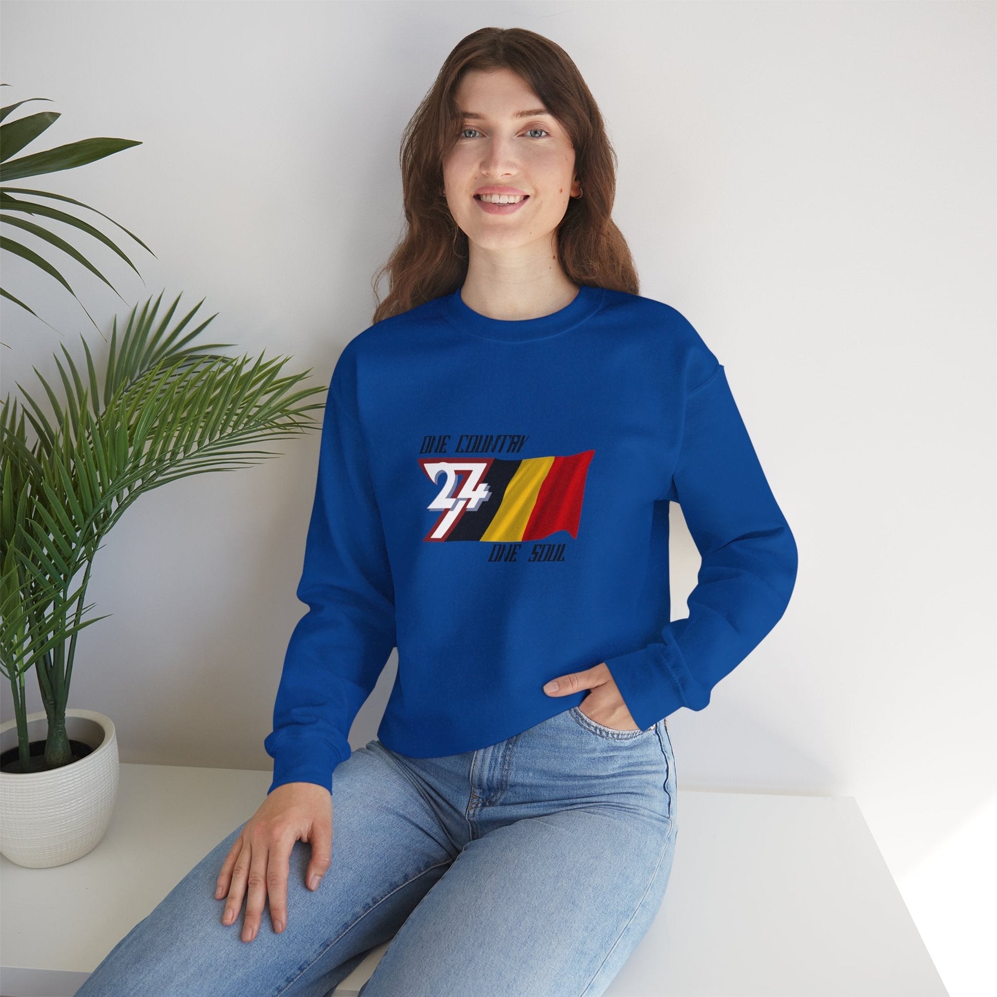 Front view of a female model wearing the royal blue Belgium flag graphic sweatshirt, demonstrating the classic fit.