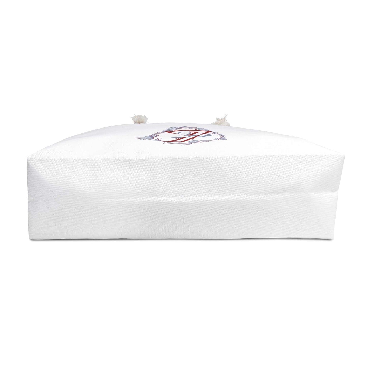 Bottom view of the floral weekender bag, showcasing the wide, flat rectangular base designed for maximum packing capacity and stability on the go.