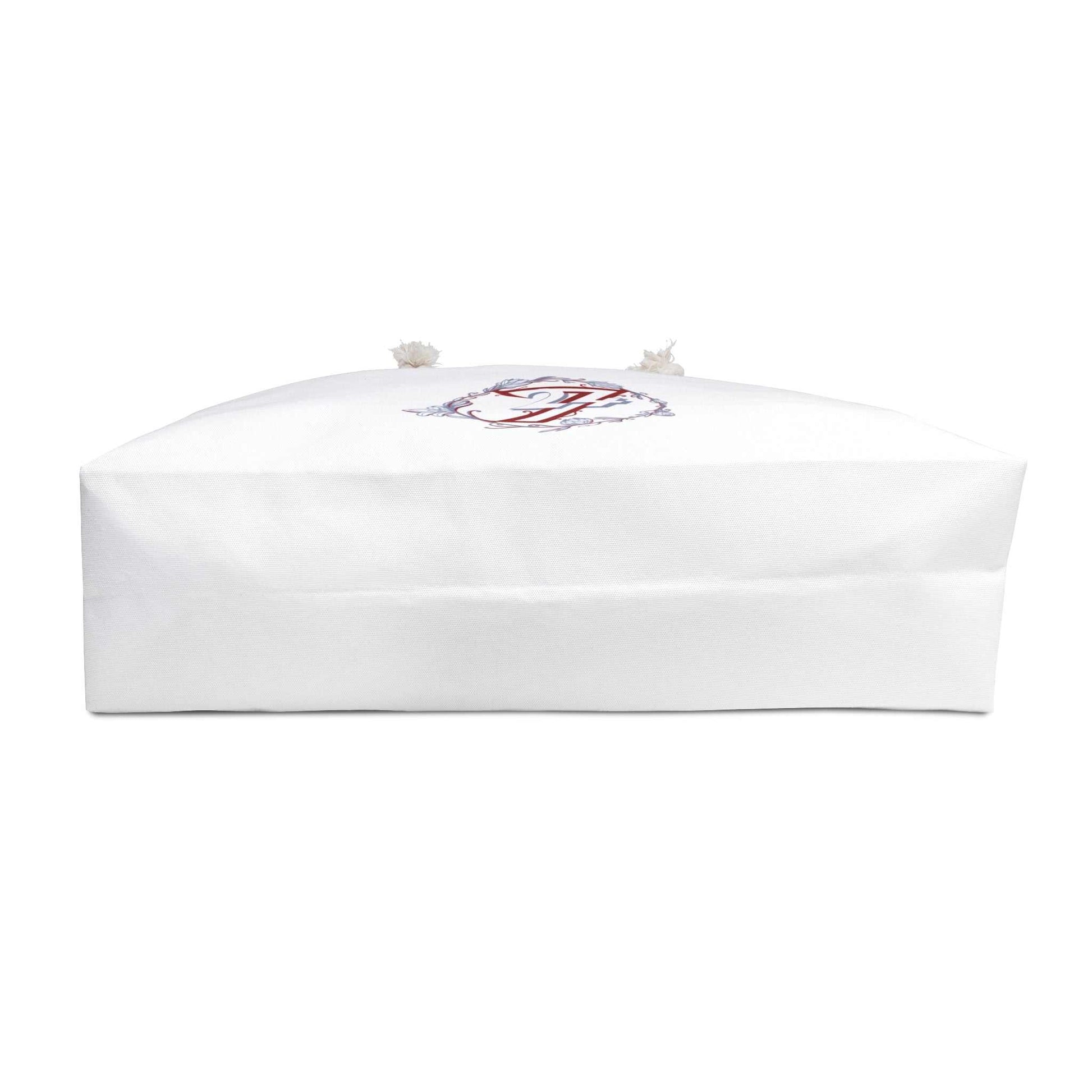 Bottom view of the floral weekender bag, showcasing the wide, flat rectangular base designed for maximum packing capacity and stability on the go.