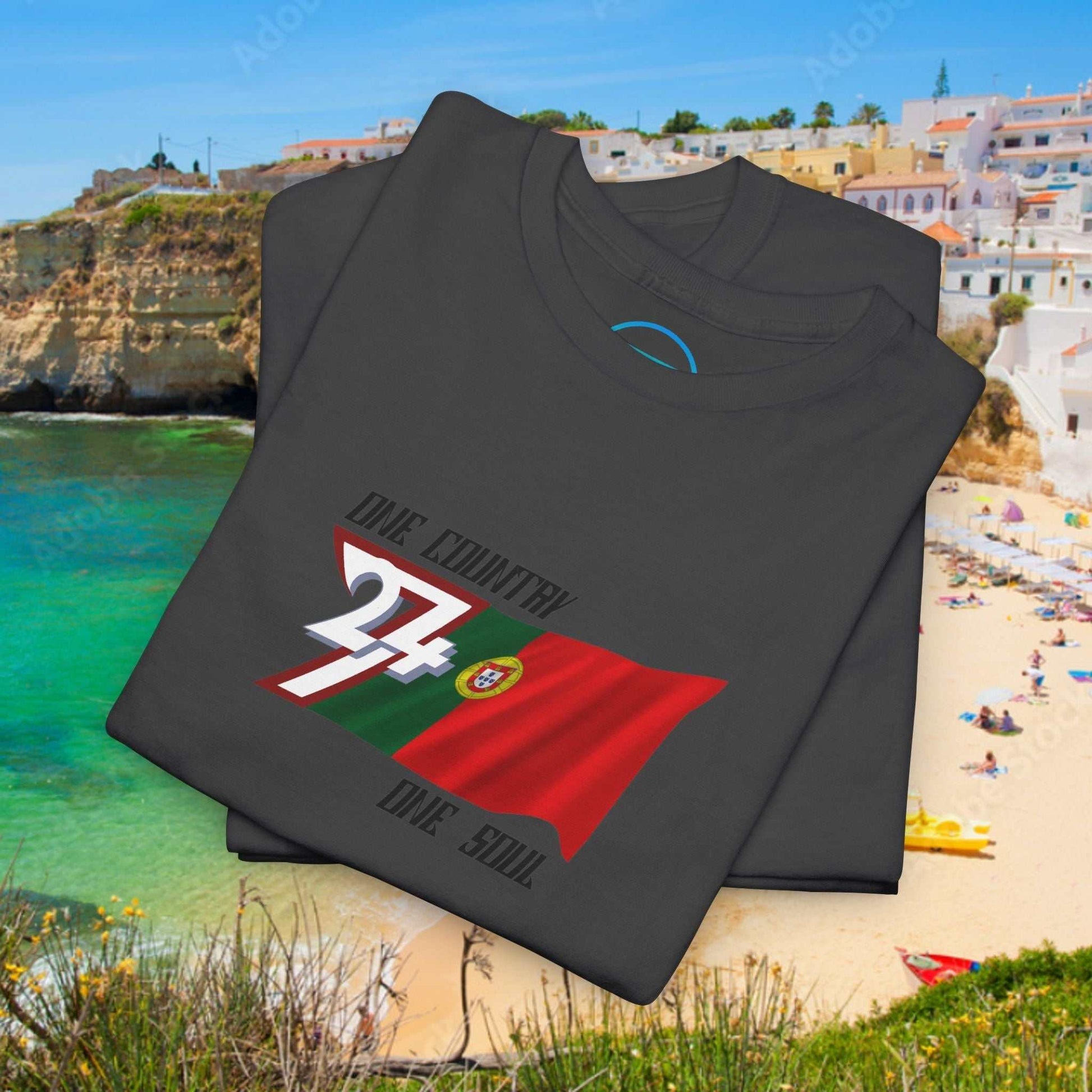 Neatly folded charcoal gray cotton tee showing the hand-drawn Portugal flag illustration.