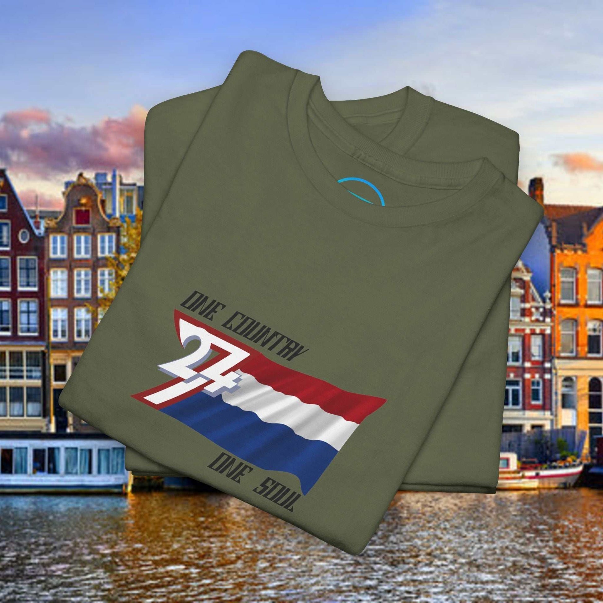 Neatly folded military green cotton tee showing the hand-drawn Dutch flag illustration for gifting.