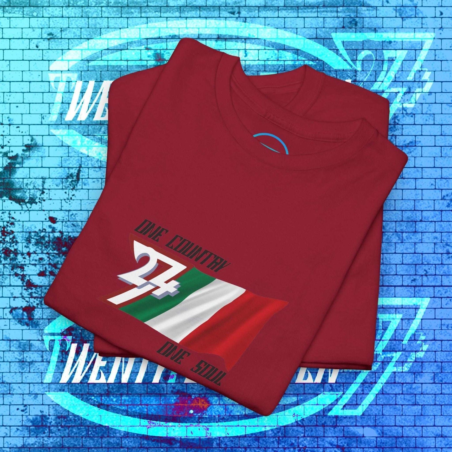 Folded red cotton tee showing the hand-drawn Italian flag illustration and "One Country One Soul" text.