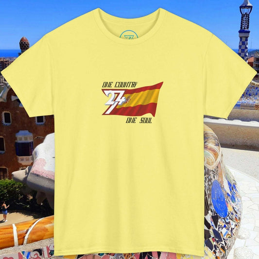 Unisex yellow Spain Flag Graphic Tee with hand-drawn Spanish flag and "One Country One Soul" text design against a Barcelona mosaic backdrop