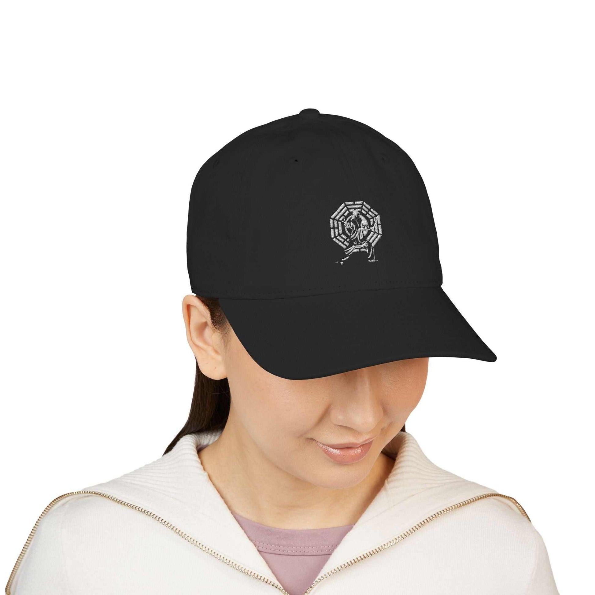 Front view of female model wearing the black Tai Chi logo baseball cap