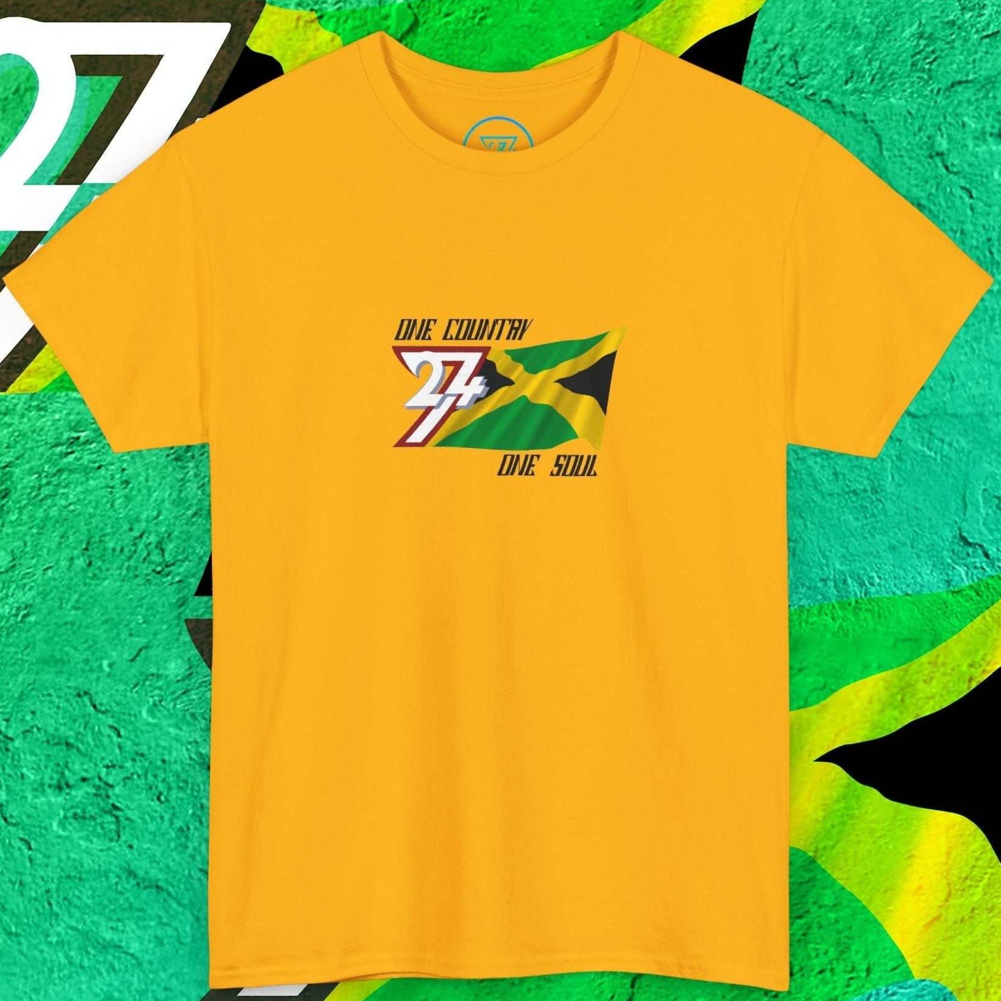 Front view of a gold unique Jamaica flag t-shirt featuring a hand-drawn black, green, and gold "X" and the "One Country One Soul" slogan.