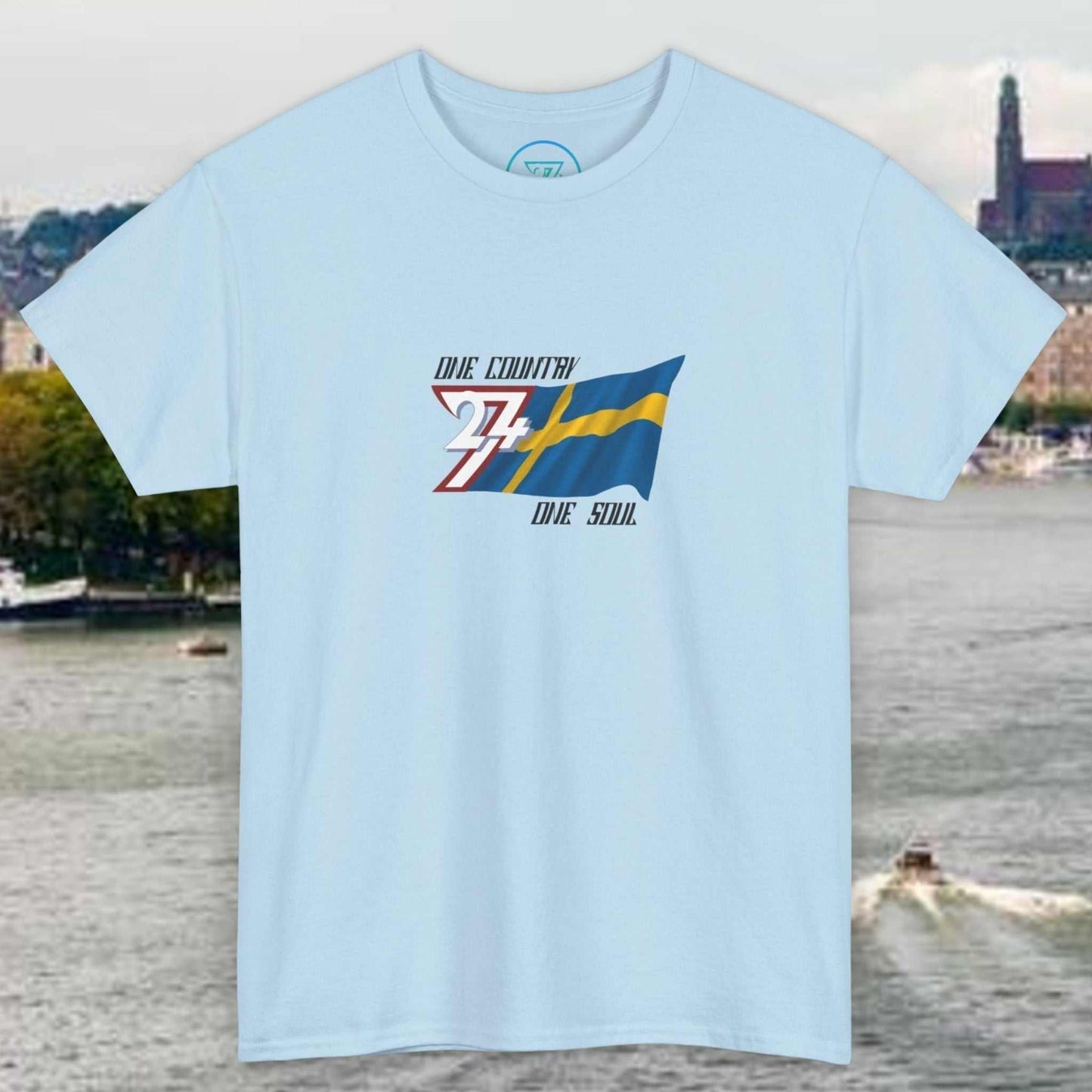 Light blue Sweden flag graphic tee with hand-drawn Swedish flag and "One Country One Soul" text on front, unisex fit.