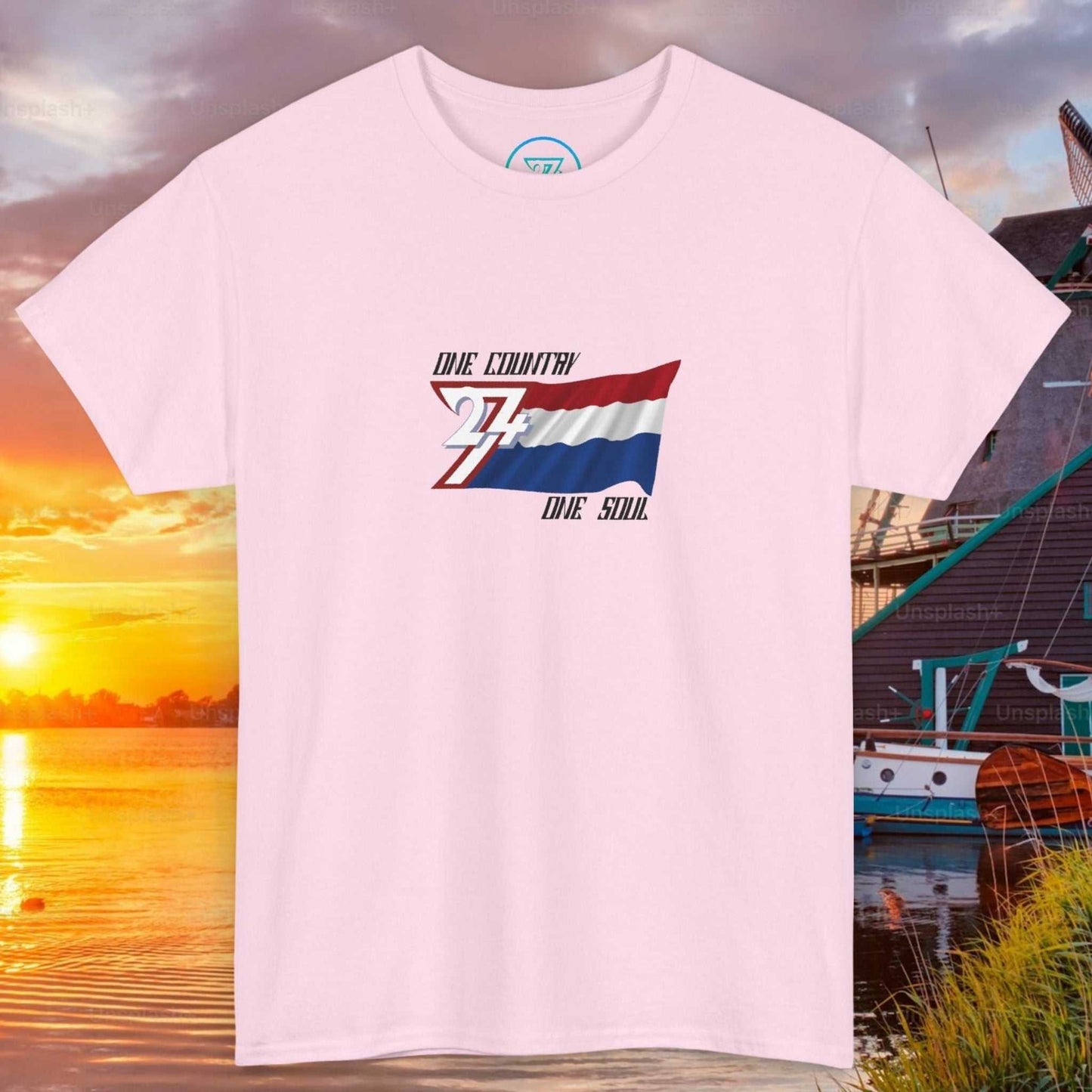 Front view of a light pink graphic t-shirt featuring a digitally hand-drawn Netherlands flag design.