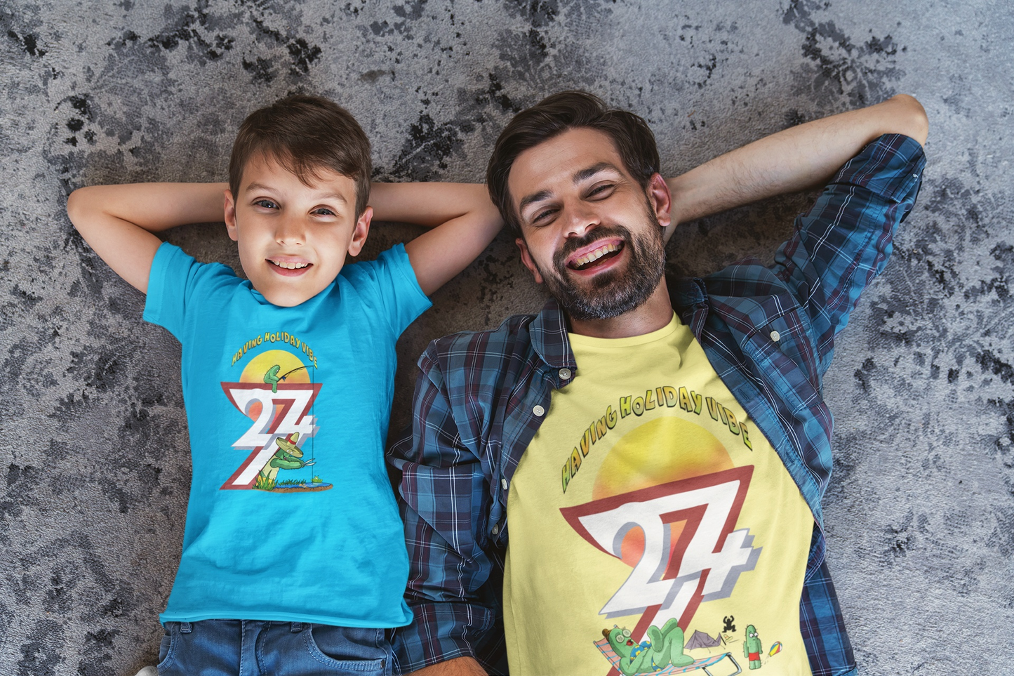 Father and son smiling together. The father is wearing a light yellow Cacti Maria camping shirt, and the son is wearing a tropical blue funny fishing graphic tee.