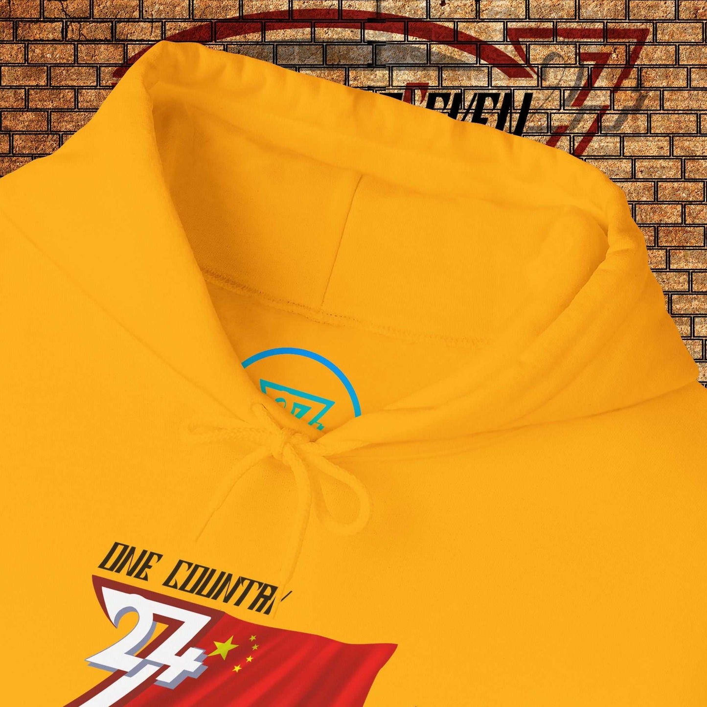 Macro close-up of the inner neck area showing the authentic 24/7 Unique Designs trademark logo on the China hoodie.
