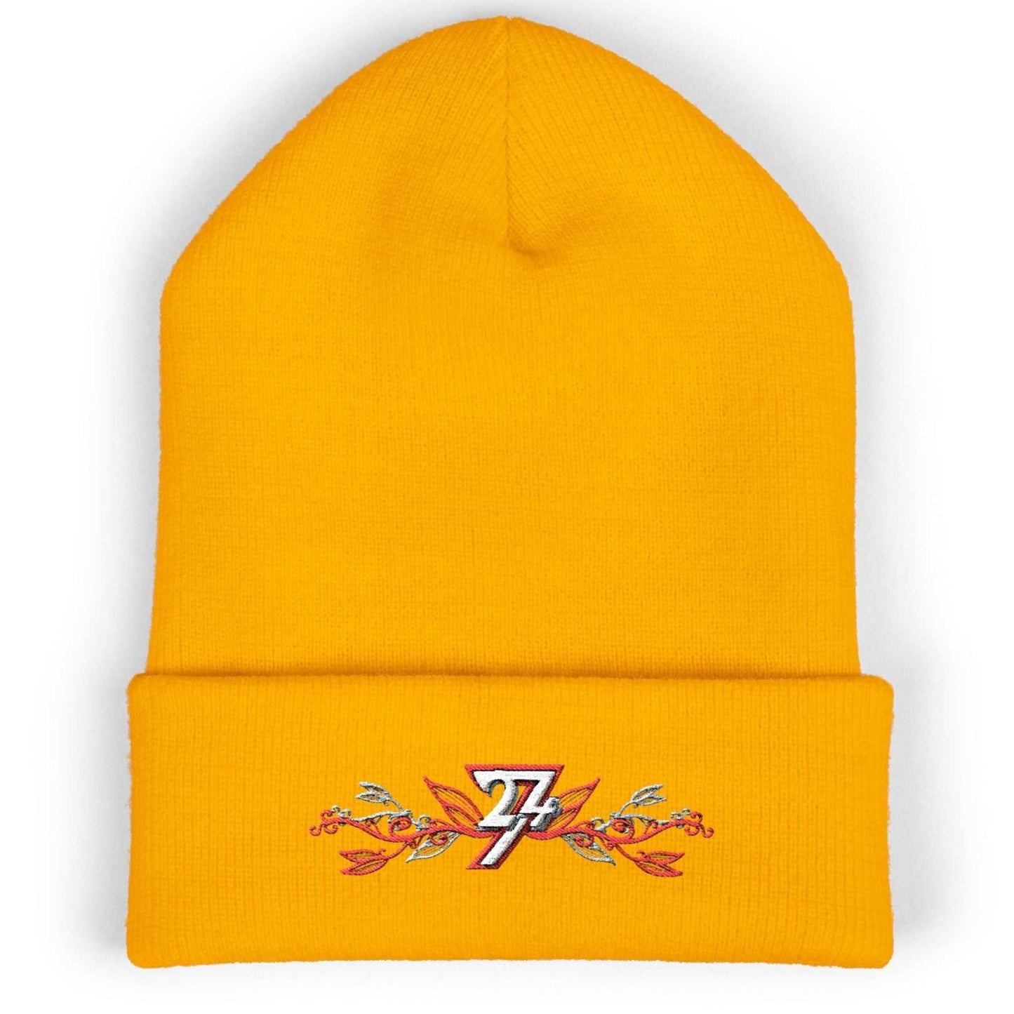 Premium gold colored winter hat showcasing the unique cuffed design and intricate floral embroidery.