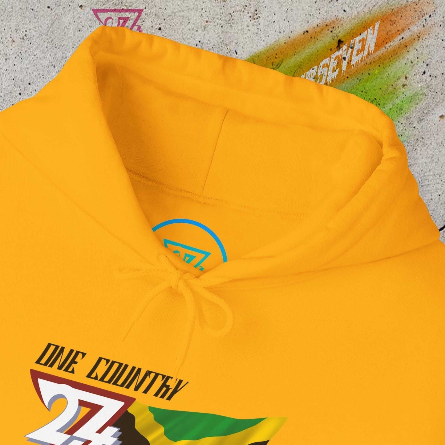 Macro close-up of the inner neck area showing the tear-away label and authentic 24/7 Unique Designs trademark logo.