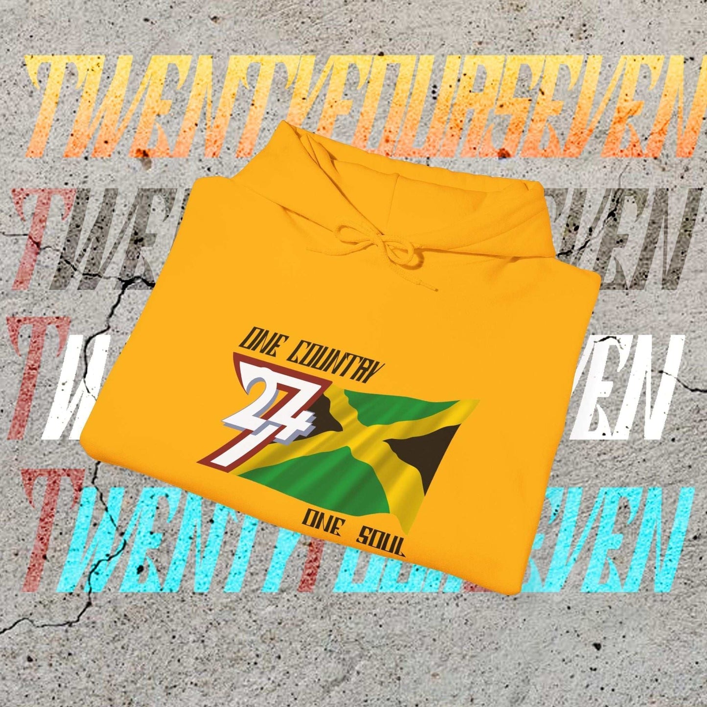 A professional display of the Jamaica flag hoodie in Gold, folded to showcase the refined hand-drawn graphic and 8oz fabric weight.