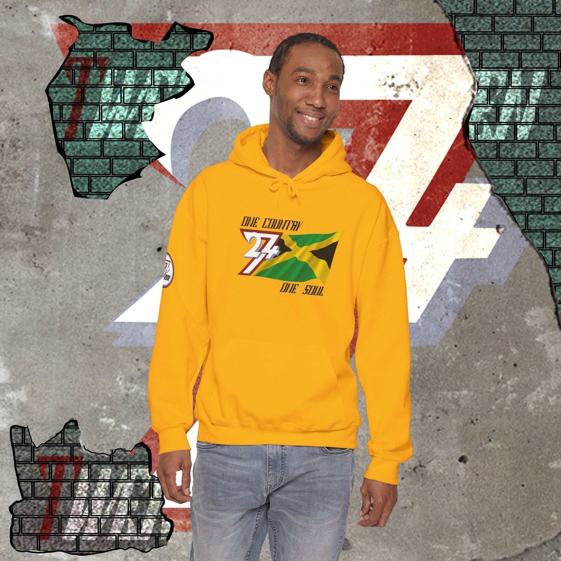 Male model wearing the Jamaica "Everlasting" edition hoodie in Gold, showing a modern, refined Caribbean streetwear look.