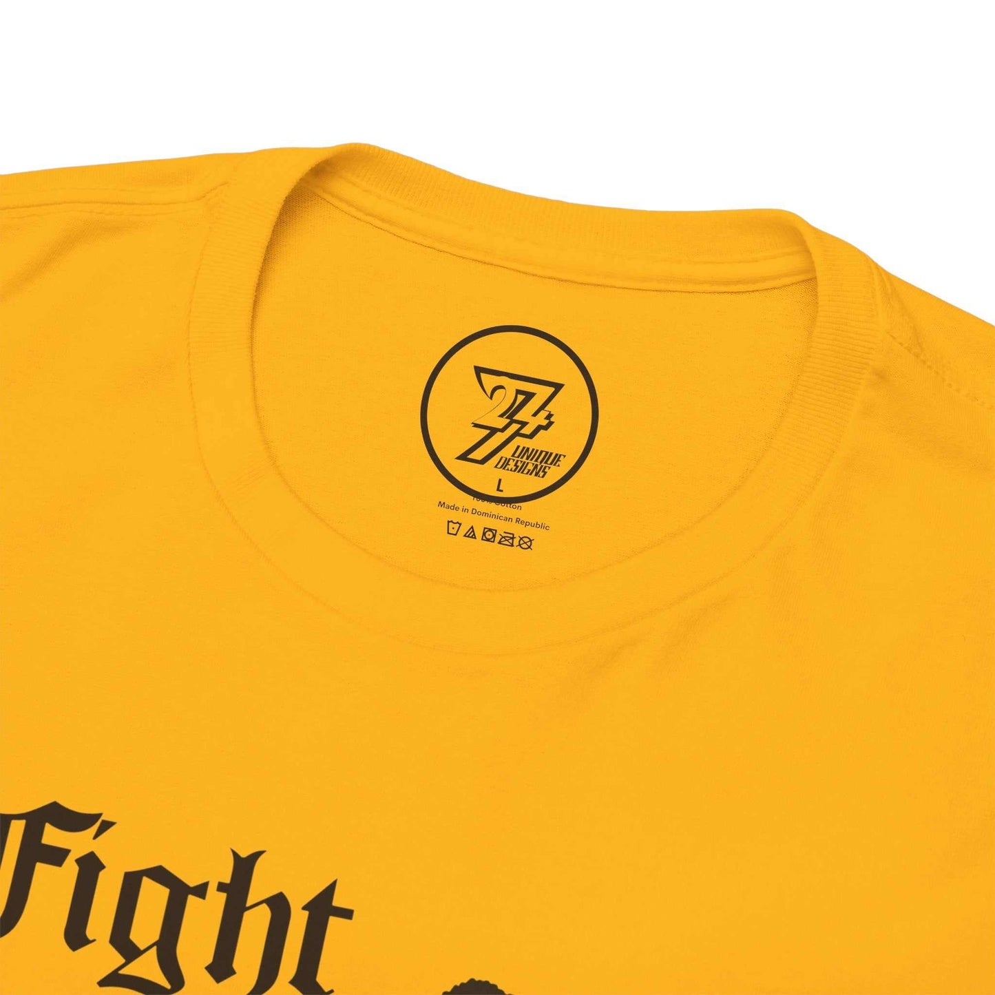 Close-up of the seamless crew neckline on the gold martial arts tee, clearly showing the official 24/7 Unique Designs inner label branding.