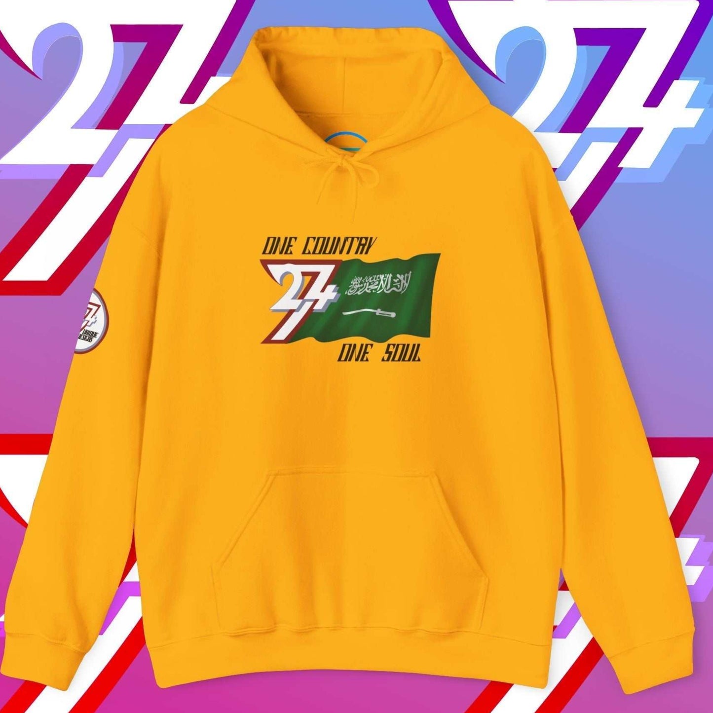 Front view of the Gold Al-Mamlakah flag hoodie featuring the refined artist-drawn design and motto.